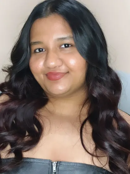 Gorgeous wavy curls for this beauty. This is a perfect party-ready look created by our expert stylist.