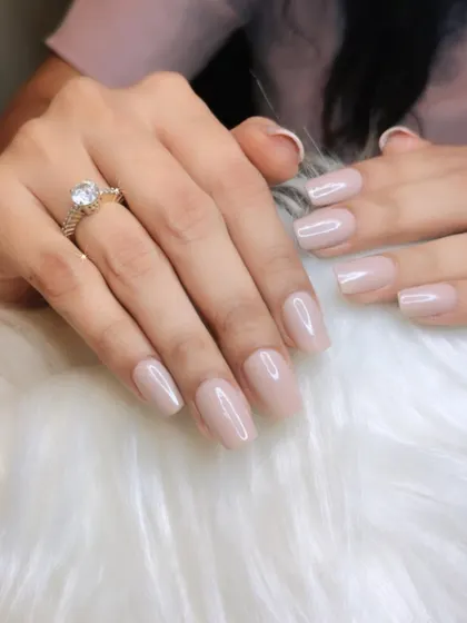 A perfect nude manicure. I work with you to find the most flattering nude shade for your skin tone, creating a clean, elegant, and elongated look.