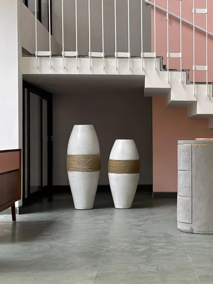 The 'Tali' planter from my GRC range, featured in a gorgeous new architecture project. The jute detail adds a warm, organic touch to its modern shape.