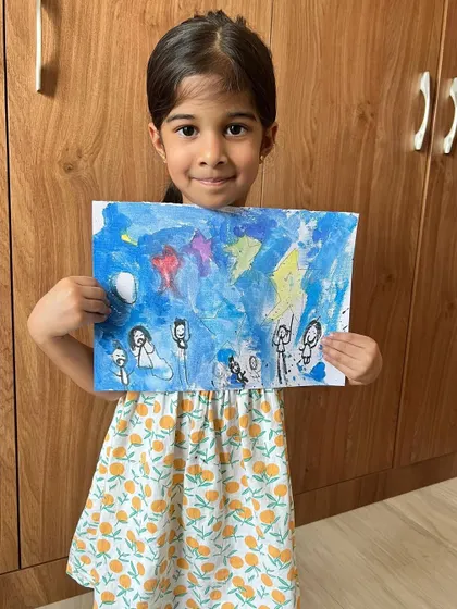 This student's painting tells a story of people watching a starry night, a theme explored in one of our imaginative online sessions.