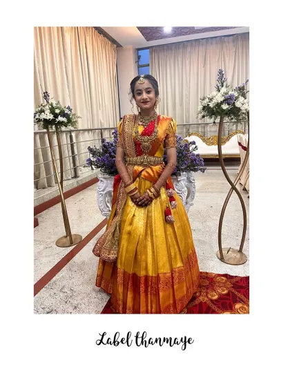 A full shot of the client in her beautiful traditional ceremony lehenga.