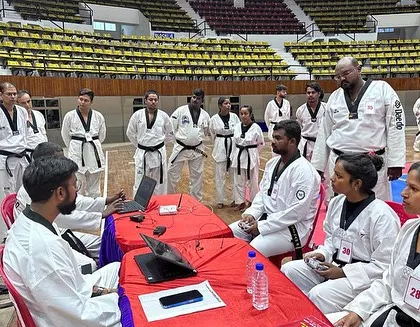 Here, I am conducting an examination for participants at the National Kyorugi Referee Seminar in Odisha. This process involves evaluating their understanding of the rules and their ability to apply them correctly under pressure.