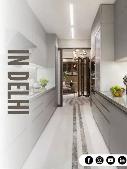 A perfect example of a galley kitchen layout. We used light grey handleless cabinets and a clean white countertop to make this narrow space feel bright, open, and highly functional.