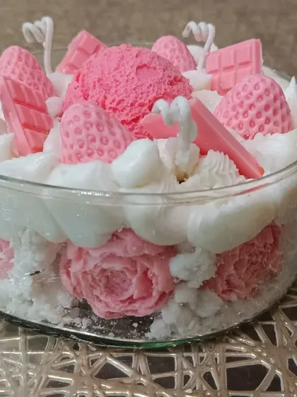 A side view of the ice cream bowl candle, showing the addition of wax roses at the base.
