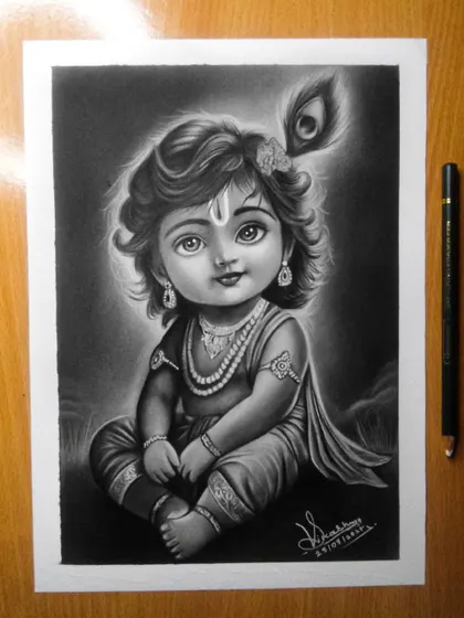 A portrait of Bal Krishna, or Little Krishna, created with graphite pencils. I aimed to capture his innocent and divine nature, focusing on his large, expressive eyes and the soft shading of his features to give the drawing a gentle glow.