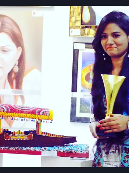 A student with her award-winning quilling art of a 'shikara' boat. We encourage our students to participate in exhibitions and celebrate their achievements.