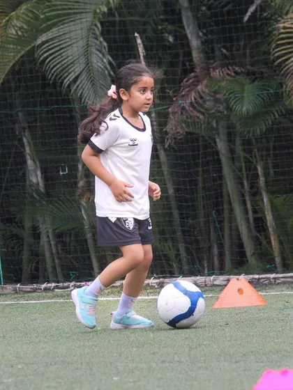 With every kick and every drill, our players get closer to their goals. This young athlete is practicing her dribbling, building the muscle memory needed for competitive play.