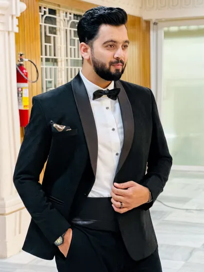 A closer look at my tuxedo, showing the satin lapel and bow tie details.