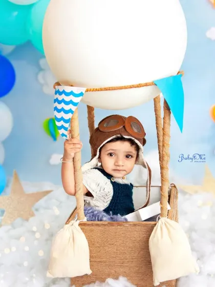 This little pilot is ready for an adventure in the clouds. The hot air balloon prop is a client favorite for creating magical and imaginative portraits.