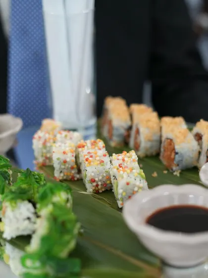 A platter of assorted sushi, beautifully presented on a banana leaf. This dish, served at IIFA, highlights our expertise in global cuisines, bringing authentic Japanese flavours to any event.