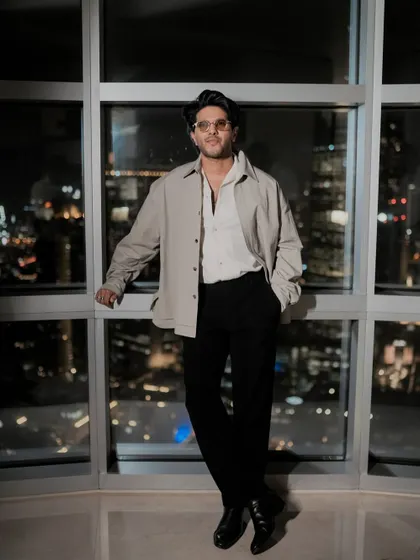 Dulquer Salmaan during the 'Lucky Bhaskar' promotions in Dubai. I styled him in this oversized jacket and classic trousers for a look of quiet luxury against the city skyline.