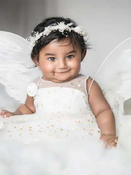 A little angel among the clouds. For baby milestone sessions, I love creating dreamy, whimsical setups like this one to capture the pure innocence and magic of your baby's first year.