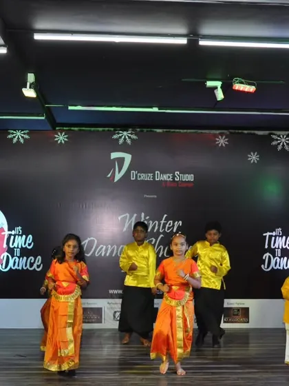 The grooming kids (3-6 years) in the middle of their traditional dance performance.
