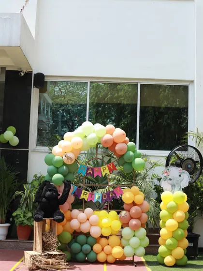 Another look at the jungle-themed photo backdrop, perfect for capturing memories of the special day.