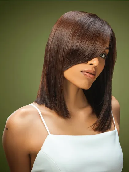 Another angle of the sleek brunette bob, showing the clean lines and deep side part that give this classic style a modern edge.