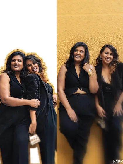 Officially a team. For our styling venture photoshoot, I designed our coordinated black outfits to reflect our brand. I'm wearing a custom waistcoat and pants, showcasing my modern tailoring skills.
