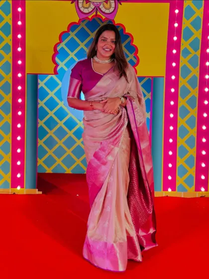 The full view of my elegant saree against the colorful festive background.