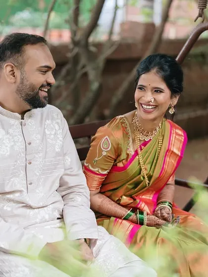 Laughter and conversation on a garden swing. This shot captures the relaxed and joyful side of a traditional pre-wedding shoot.
