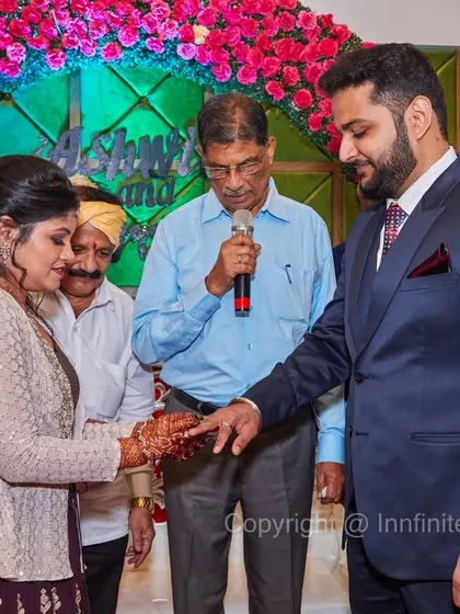 Capturing the formal ring exchange ceremony, with family and the priest present. I document these traditional rituals that are a core part of the engagement celebration.