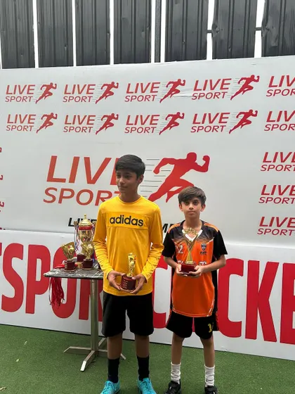 Two top performers from the U11 Junior Football League with their individual awards.