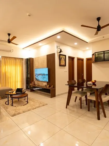 An overview of the Murlis' 3.5 BHK apartment, showing the seamless flow between the living and dining areas, unified by a contemporary design language and a neutral color palette.