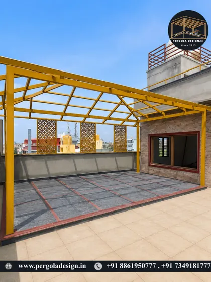 A wider view of the newly installed yellow pergola frame. The structure defines a large, open area on the terrace, ready for the roofing and finishing touches.