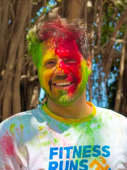 A happy, color-smeared portrait from a Holi fitness run event. It combines my love for festivals with a healthy, active lifestyle.