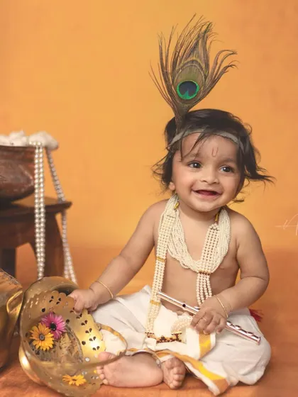 The pure joy on this little Krishna's face is priceless. Capturing these happy, unscripted moments is what makes each session unique and special.