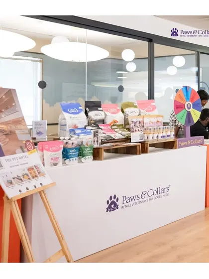 A snapshot from an "Adopt, Don't Shop" event we participated in at WeWork. Our booth is set up with premium food and wellness products, showcasing our commitment to supporting the wider pet community.