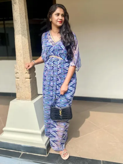 A closer view of Smitha's printed kaftan, showing the beautiful drape and vibrant pattern.