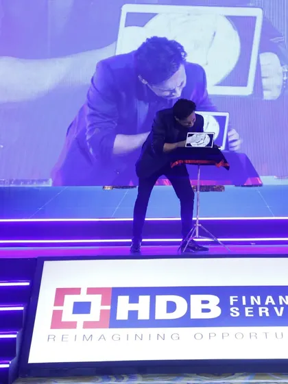 Here you can see my digital magic in action, pulling an object from an iPad. This is a great way to highlight a brand's focus on technology and innovation during a corporate show.