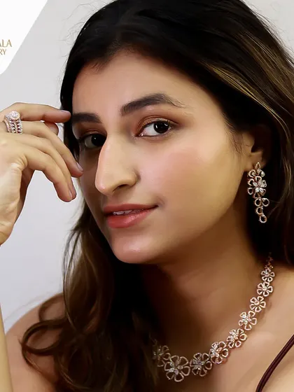 The full color version of the model wearing the floral diamond set. The rose gold and sparkling diamonds create a look of warm, romantic elegance.