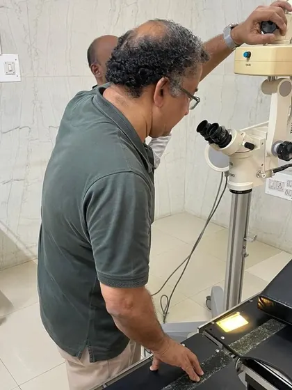 A close-up of our mentor Jithendran examining the microscope. This repair required deep technical knowledge and patient problem-solving, skills we are passionate about sharing.