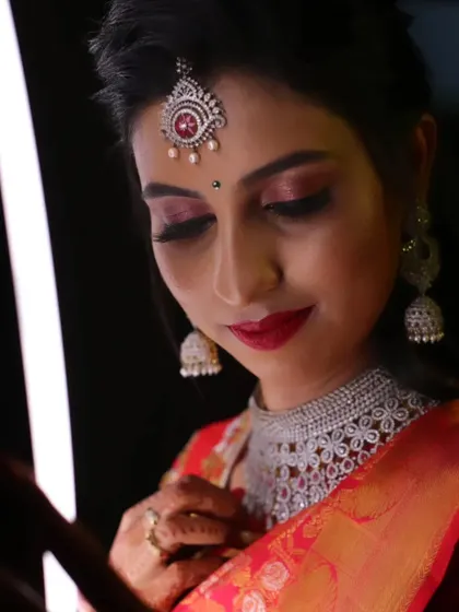 A close-up of this bride's reception makeup, focusing on the dramatic eye makeup and the stunning diamond jewellery.