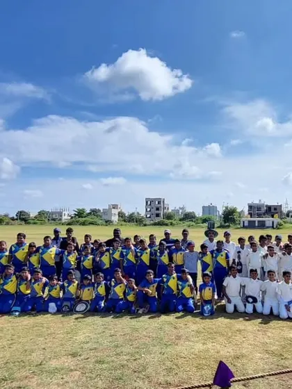 A large group photo of both teams after a match on the Hubli tour, promoting sportsmanship.
