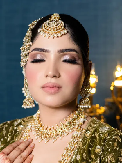 A close-up of a beautiful bridal makeup look with soft brown smokey eyes and a nude lip. Notice the seamless blend and the radiant, non-cakey skin finish.