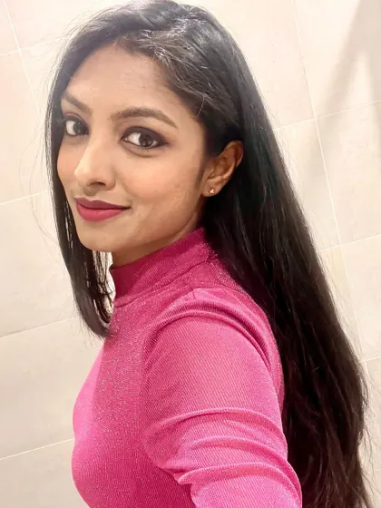 A close-up selfie showing my makeup and outfit for the Women's Day event.