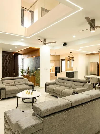 Welcome to Golden Feather, an exquisite independent villa I constructed and designed for Vikas. The home maximizes natural light with its striking double-height spaces and a blend of traditional and modern elements.