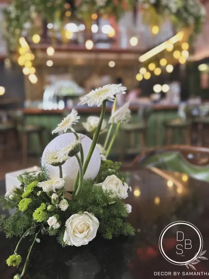 Centerpieces taking center stage. For the KGA's 50th year celebration, we used playful moon orbs within the floral arrangements to add a touch of drama and whimsy.