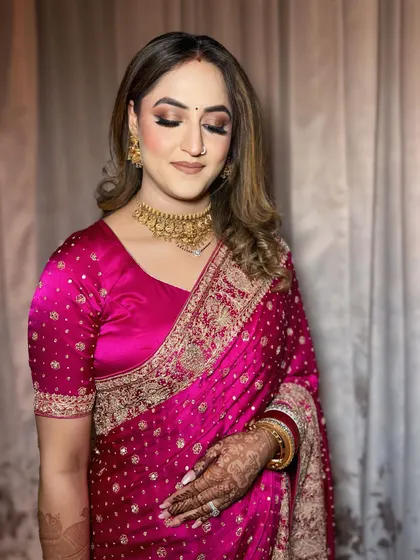 A closer view of the reception makeup, showing the shimmering eyeshadow and perfectly blended skin. This soft glam look is ideal for an evening celebration.