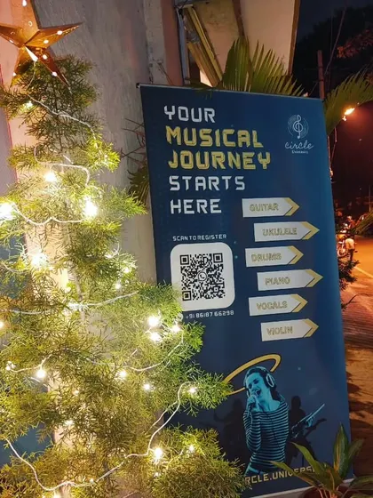 A close-up of our sign-up banner and festive decorations. We invite everyone to scan the code and start their musical journey with us.