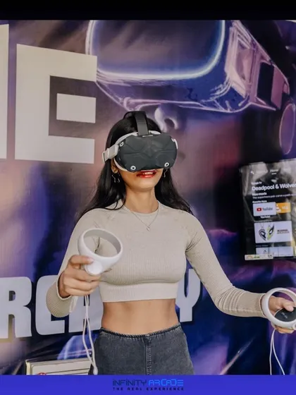 Ready for action. A player holds the controllers, prepared to dive into one of our many exciting VR games.