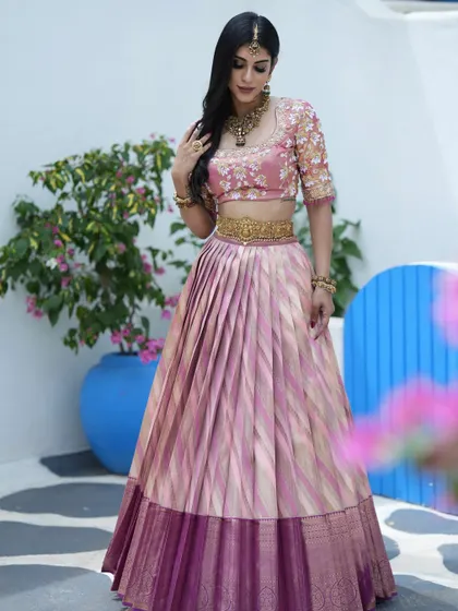 Another angle of the pink and gold half saree, highlighting the craftsmanship and the beautiful color combination.