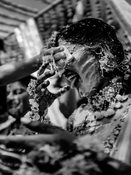 A black and white version of a wild Haldi moment, emphasizing the raw emotion and energy of the celebration.