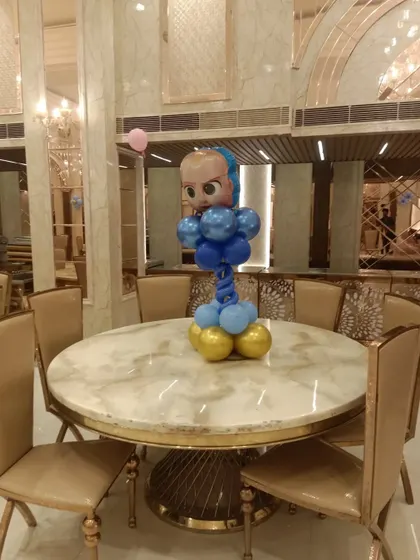 A Boss Baby themed balloon centerpiece for a table.