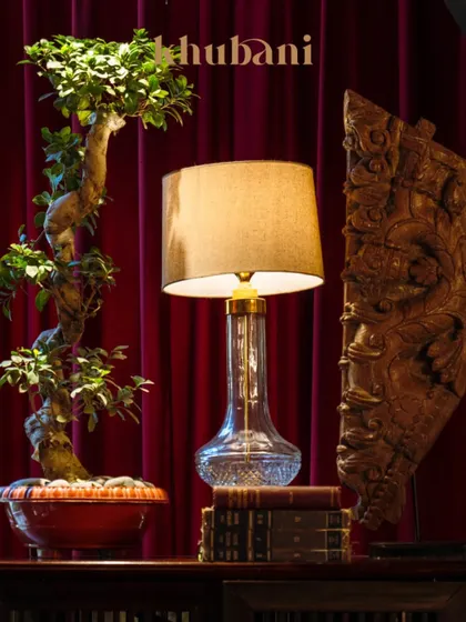 Every corner tells a story. This carefully curated nook, with its bonsai tree, vintage books, and elegant lamp, reflects my belief in thoughtful living and artistic expression.