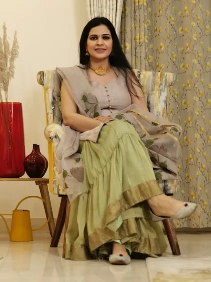 Another one of my favorite accessories is a statement necklace. Here, I've paired a heavy gold necklace with a sharara suit, which instantly elevates the entire look.