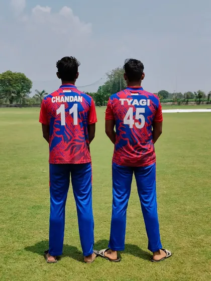 A view from the back, showing their team jerseys. Chandan and Tyagi, a formidable pair.