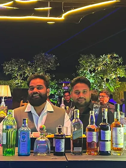 Our team at an outdoor event, smiling and ready to provide top-notch service. We bring a positive and friendly attitude to every party, ensuring your guests feel welcome.