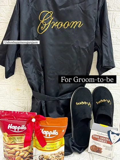 This gift set for the groom-to-be includes a personalized robe, slippers, and his favorite dry fruits and snacks.